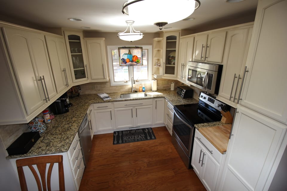 New kitchen area it all stainless appliances and lots of counter space supplies