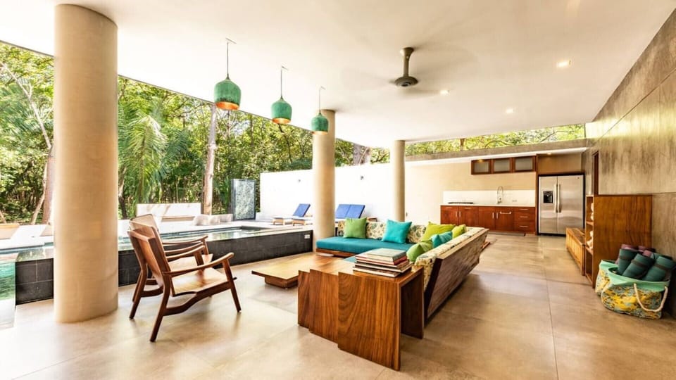 covered balinese day bed / lounge overlooks pool 