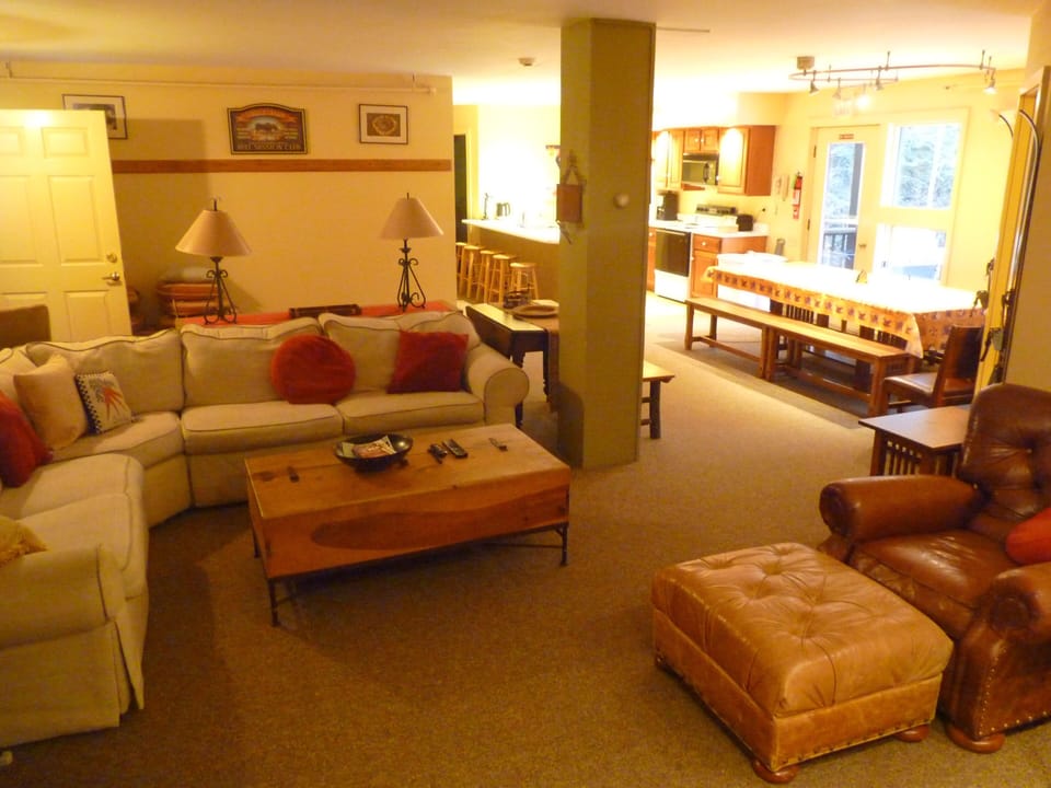 Main living room, dining, kitchen in back. Fits lots of happy people.