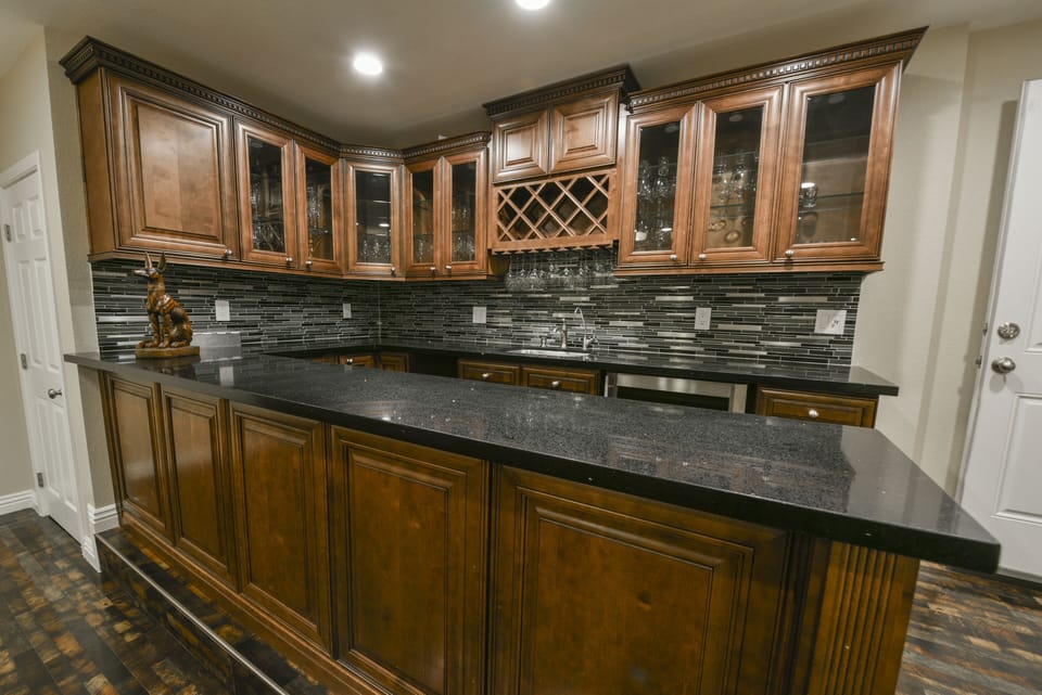 Mancave Bar, wine cooler , icemaker, sink, filtered water, stemware collection 