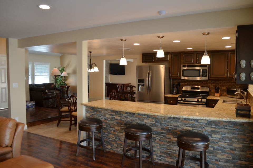 Granite kitchen bar counter great for entertaining friends while preparing meals