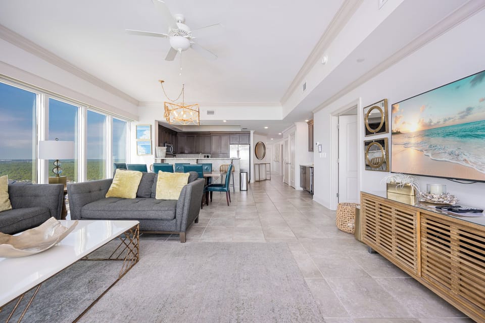 Embrace relaxation in a stylish living area, enjoying serene views and cozy seating as you plan your beach adventures