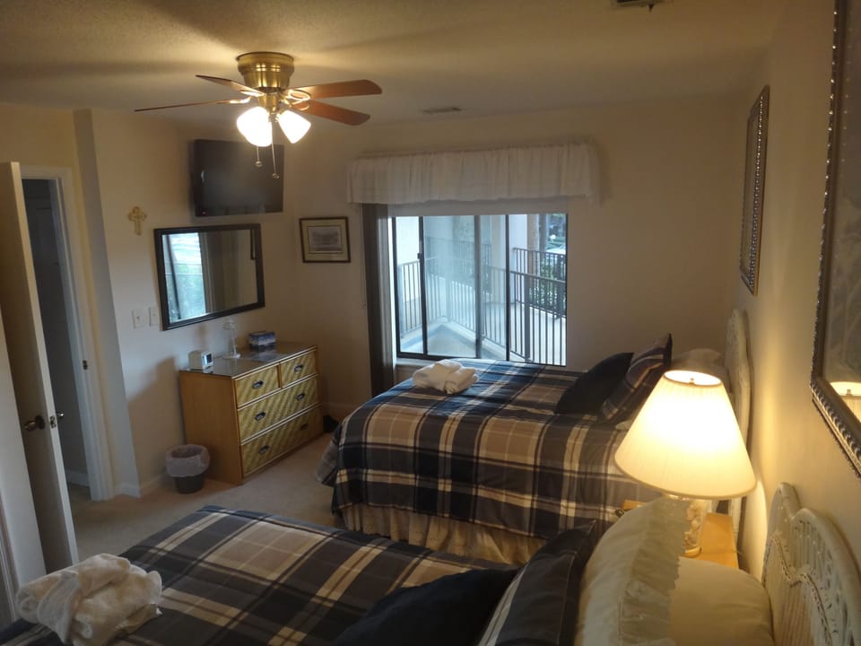 Alternate view of back bedroom. Flat screen HDTV mounted on wall.