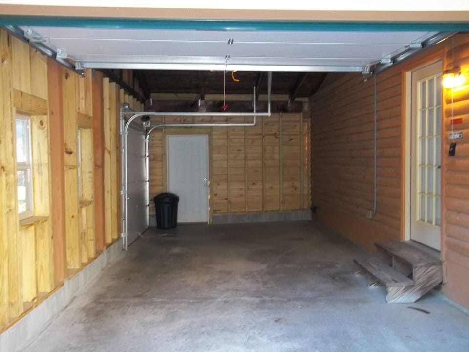 Garage  Room for one car and motorcycle.  TWO GARAGE DOORS