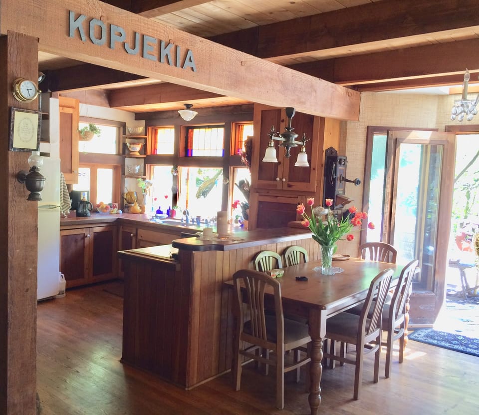view of kitchen  and Dining area-view of French doors opening to the main deck.