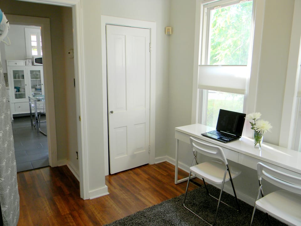 2nd bedroom w/ closet & desk. The chairs can be used at the kitchen table, too.