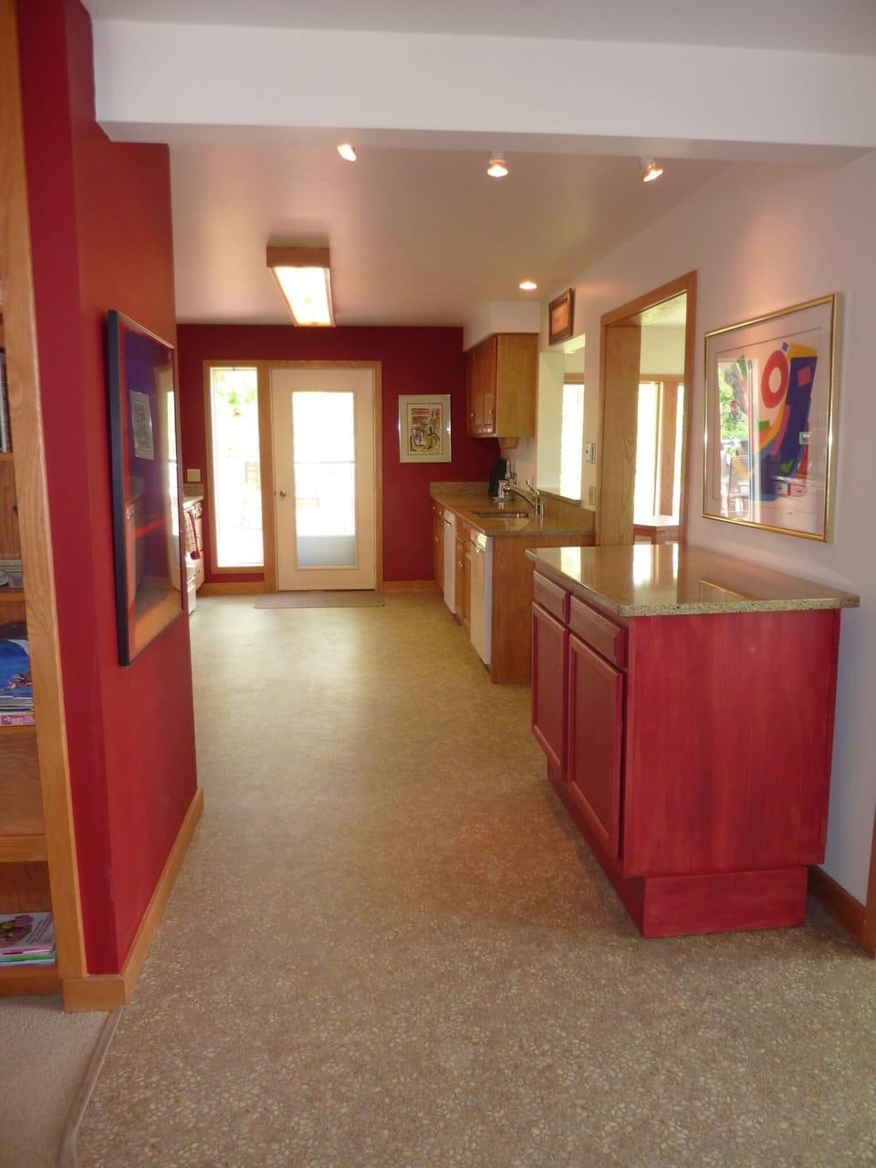 Main Floor Kitchen, included two dish washers. Opens to dining room and deck. 