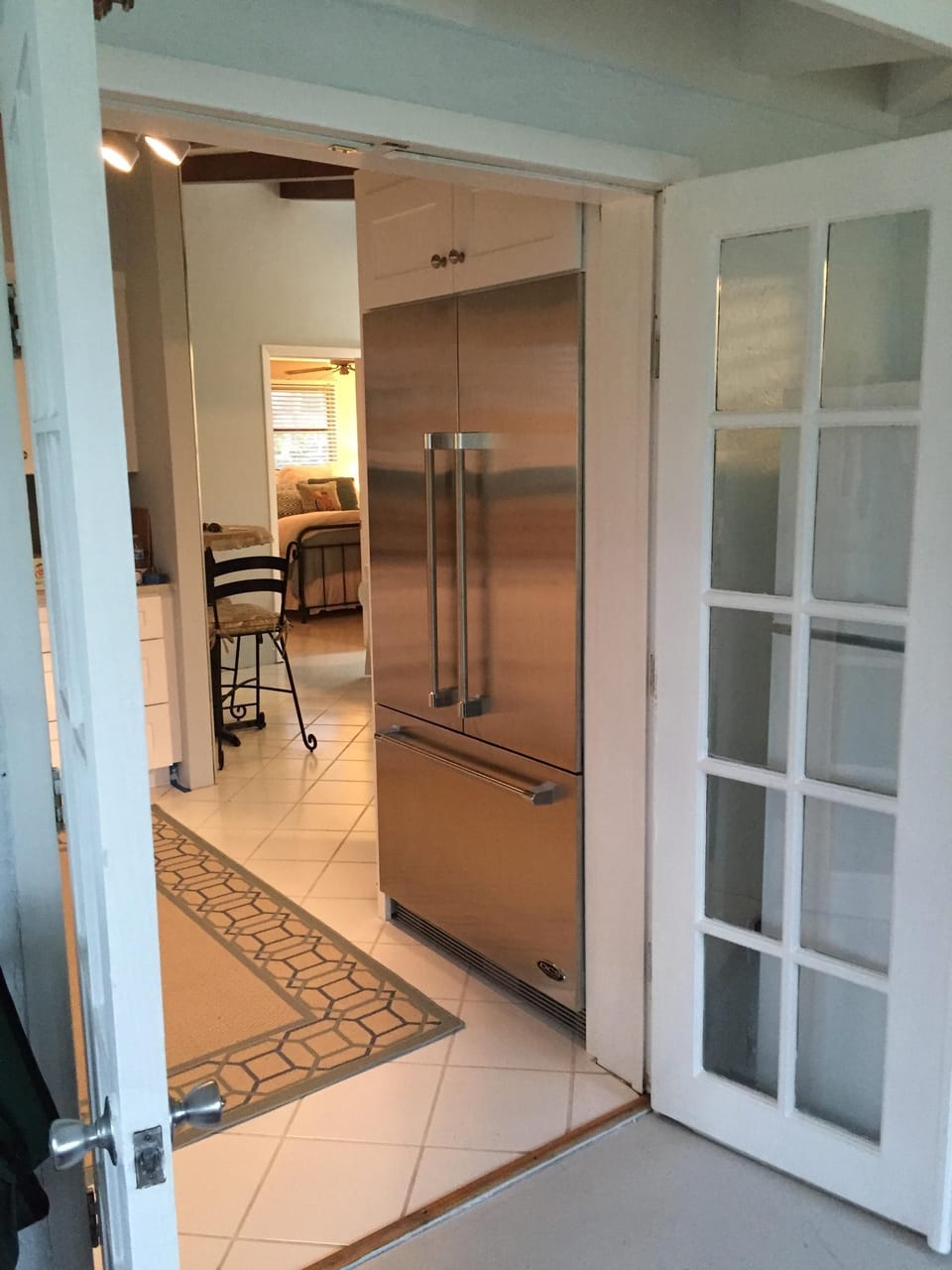 Looking at the  built in fridge in the kitchen from the lanai.