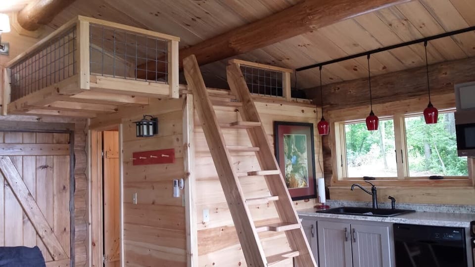 Ship's ladder leads to a queen mattress in the loft. 