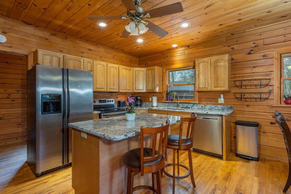 large kitchen with granite countertops for family and friend gatherings