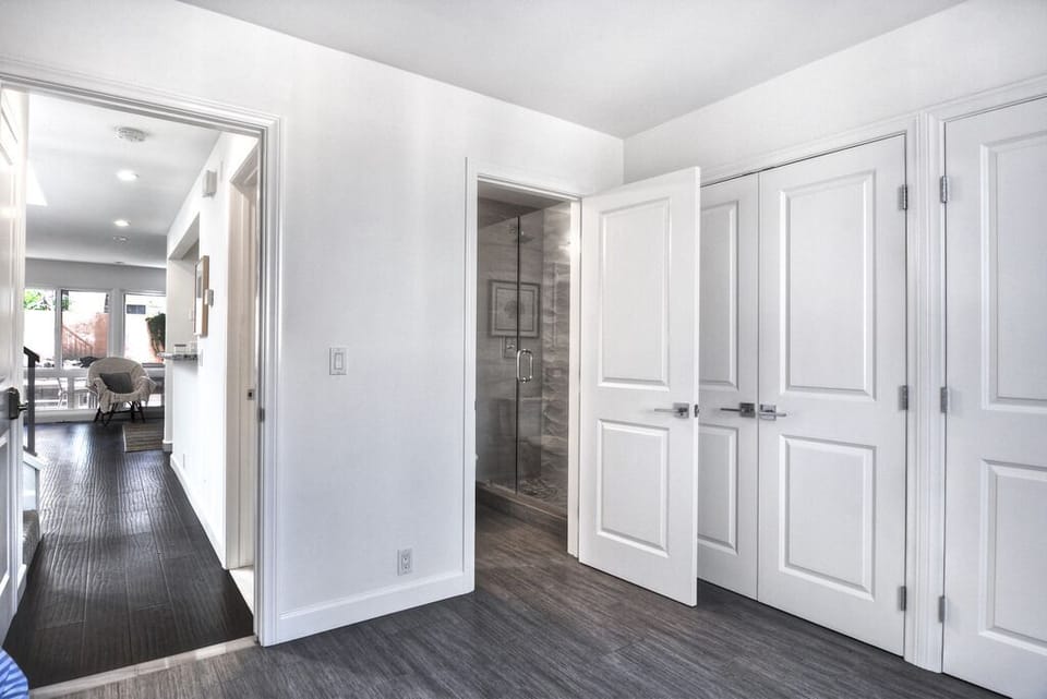 Downstairs guest bedroom entrance to its own bathroom