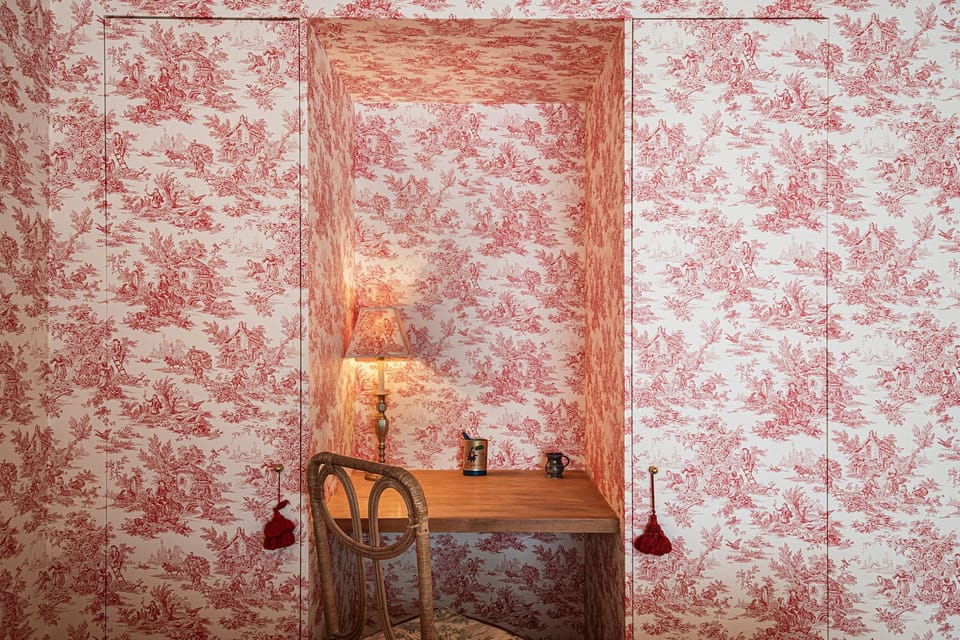 A cozy workspace in between invisible closet doors.