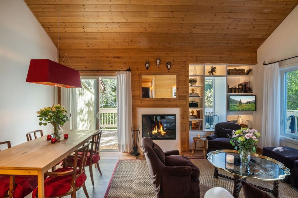 Living room and dining areas with access to the deck only in the summer.