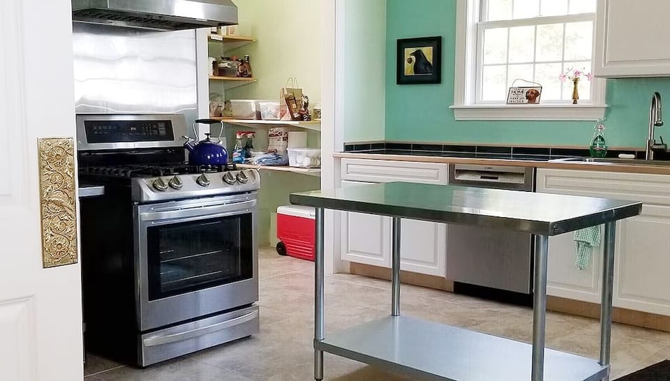 The large and well-equipped kitchen and pantry are bright and inviting.