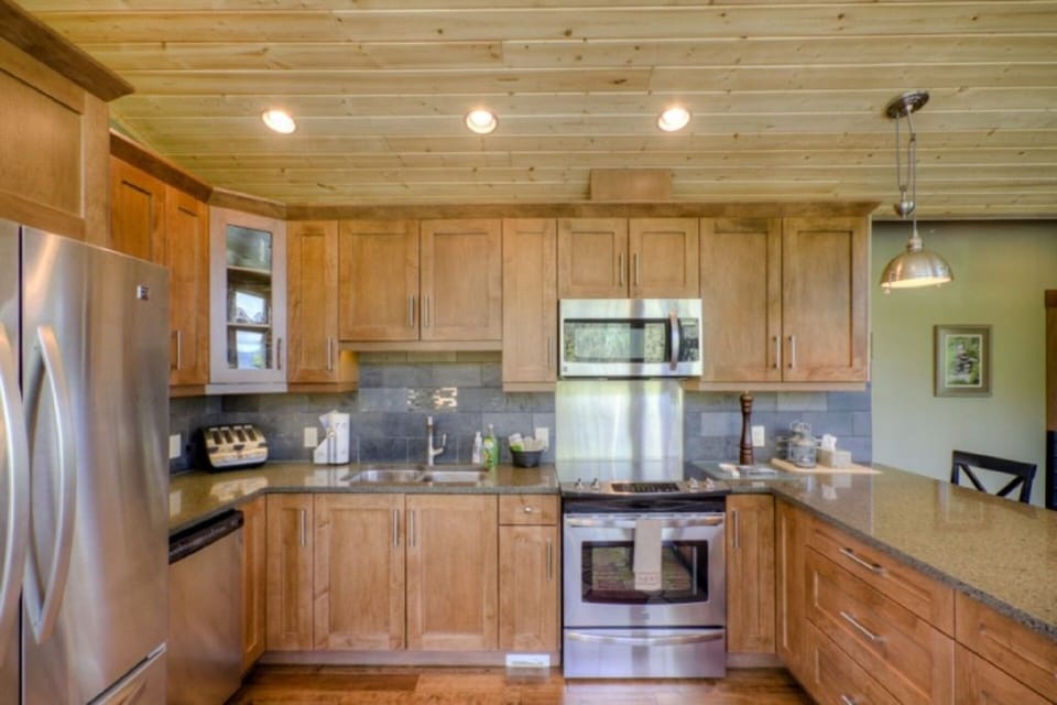 Kitchen with eating bar, fully stocked
