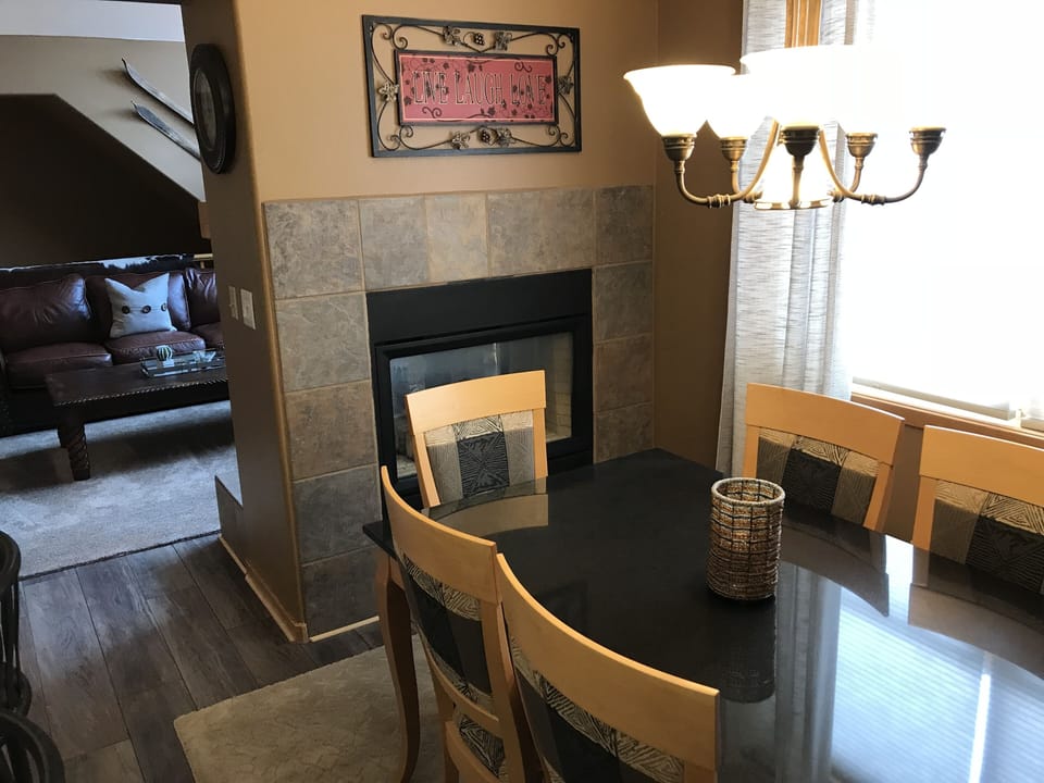 Dining room with fireplace and seating for 6. 