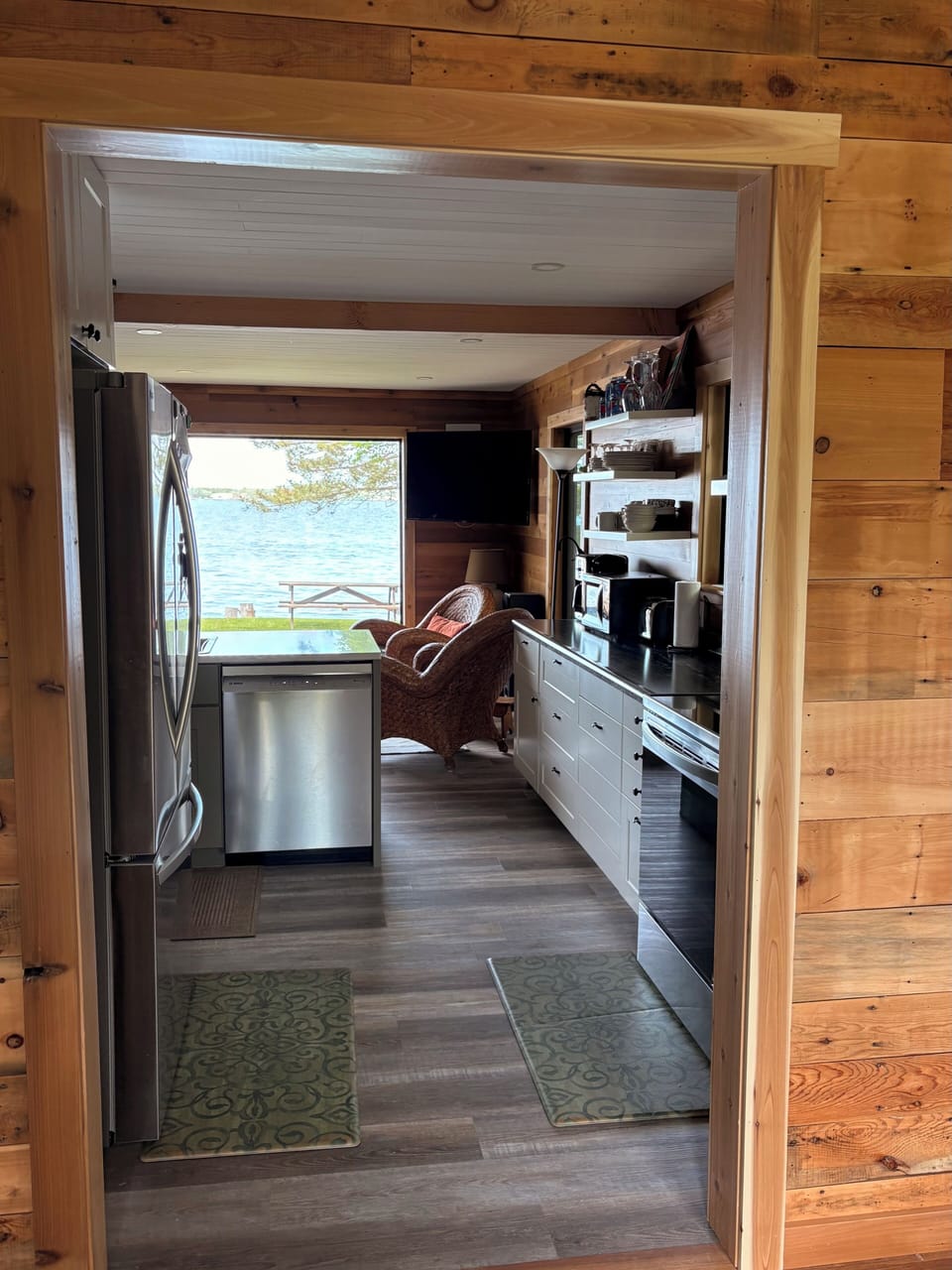 Stepping inside the front door brings  views of kitchen, living room, Rainy. 