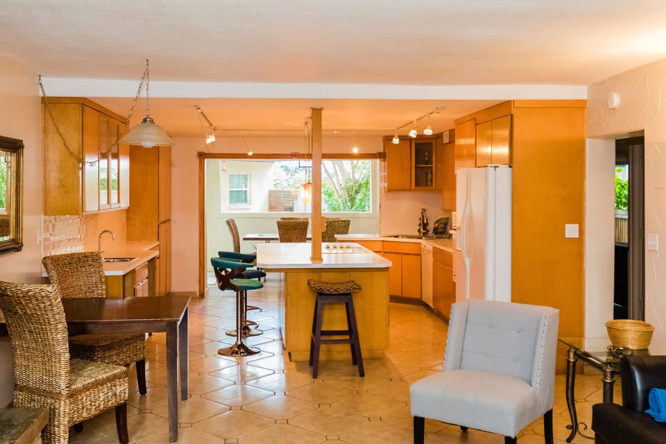 Large open concept kitchen area. table for 2-4.  large window, seating for 8.