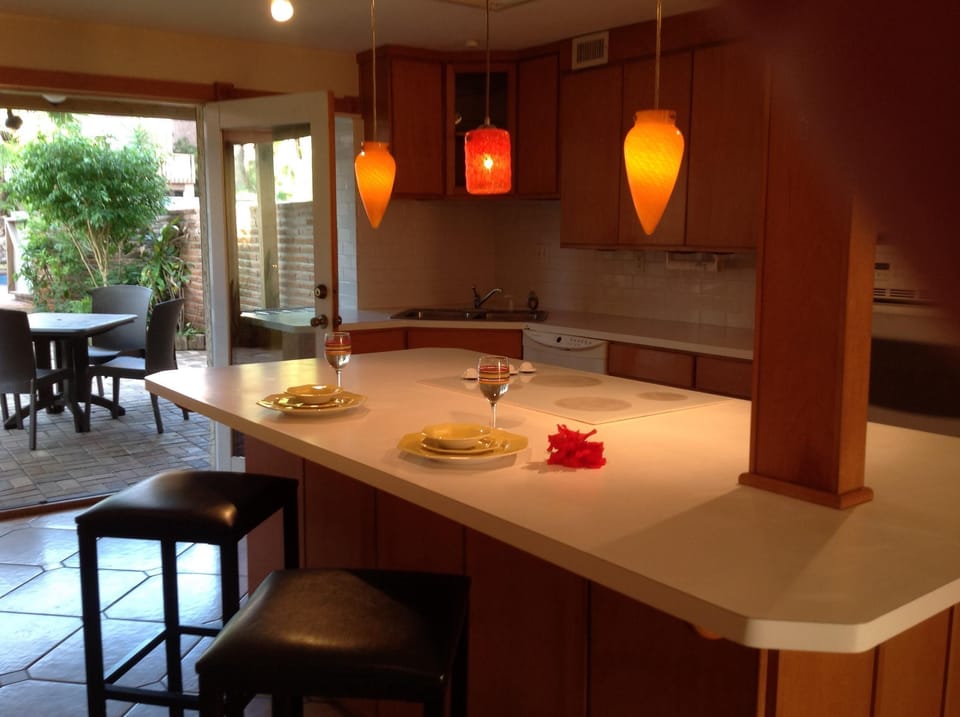 Great entertaining seating between living area, kitchen and poolside patio.