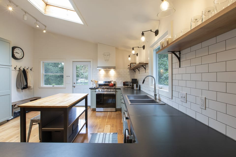 Kitchen and side entry & mud room area. Never too many chefs in this kitchen ;)
