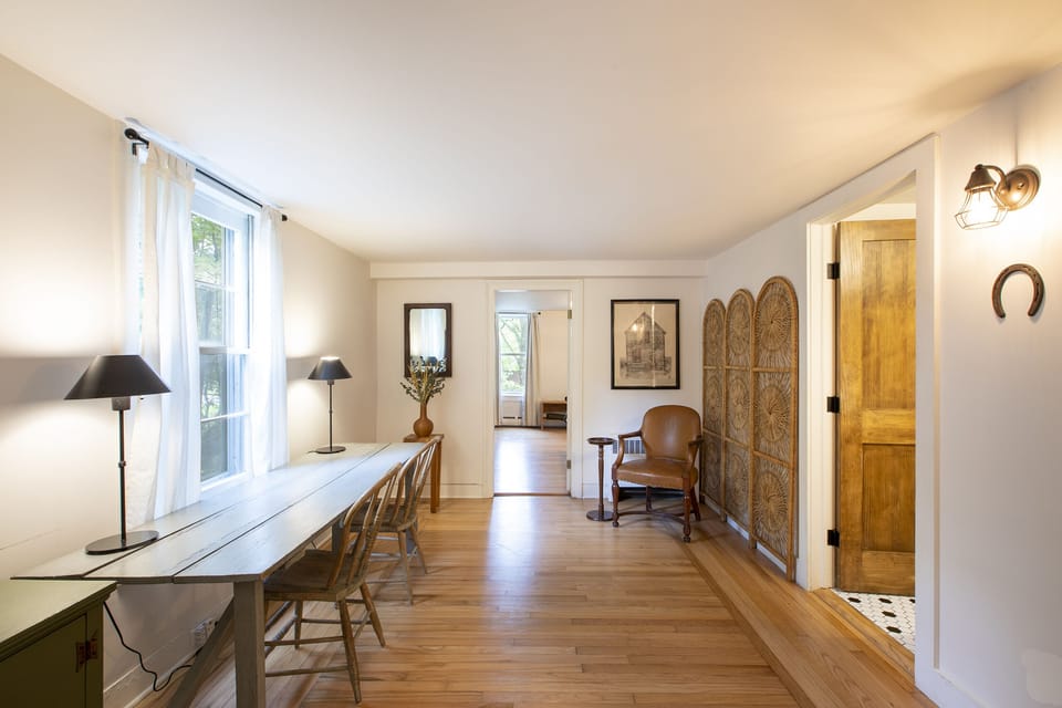 Work room off the dining room. Bathroom on the right, bedroom in the front.