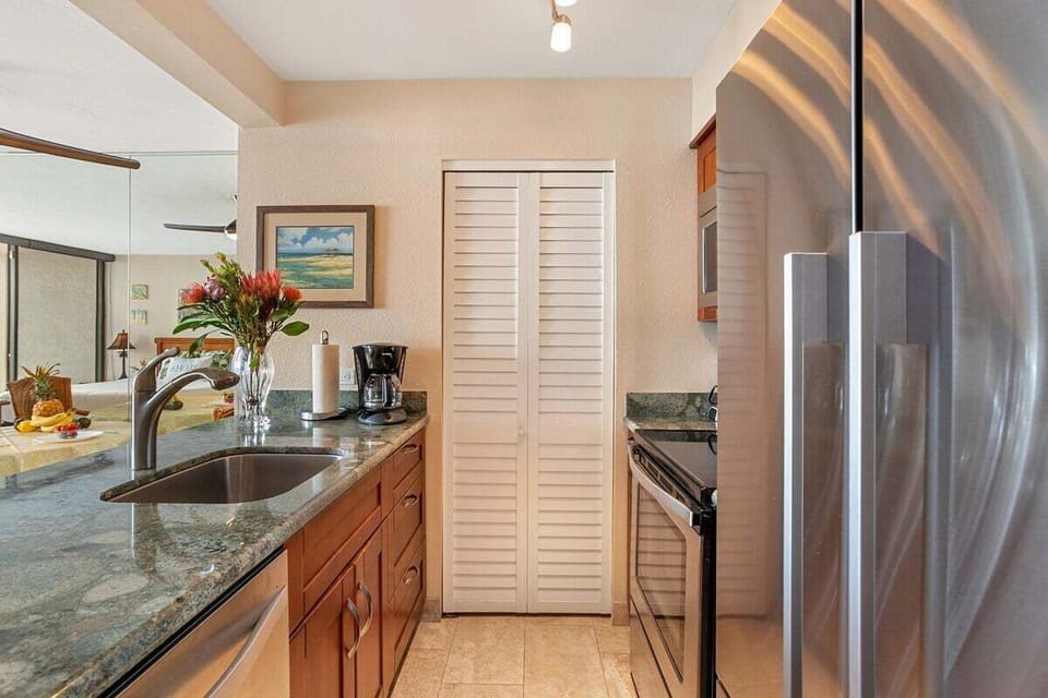 Enjoy a functional kitchen with granite countertops and breathtaking ocean views