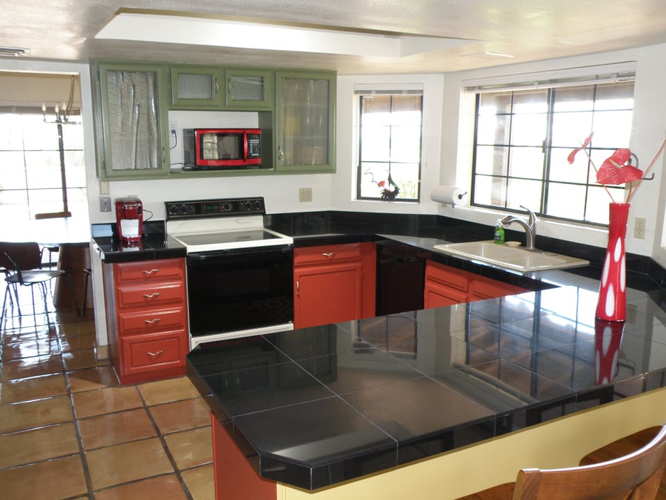 Bright cheery kitchen with glass front cabinets
