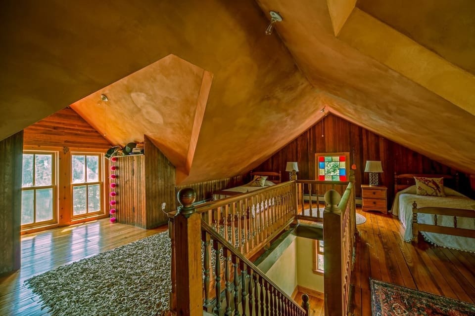 Two single beds are in the large cozy attic