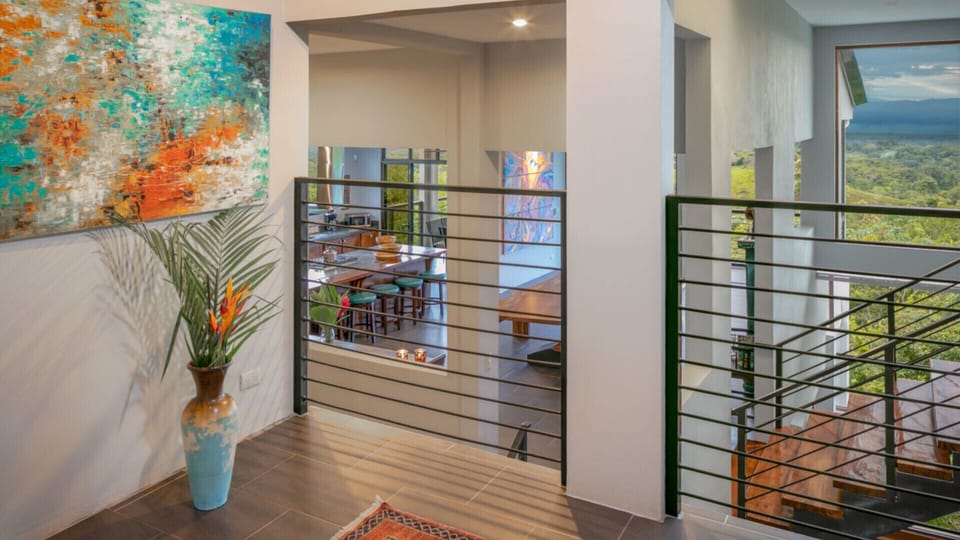 The main entrance landing overlooks the kitchen.