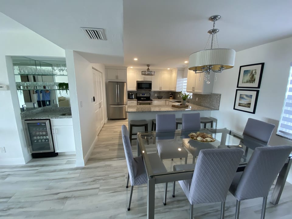 Open concept kitchen, dining room and bar area