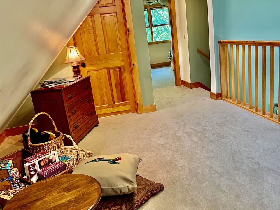 The loft is adjacent to the primary suite. Games and puzzels are in the loft