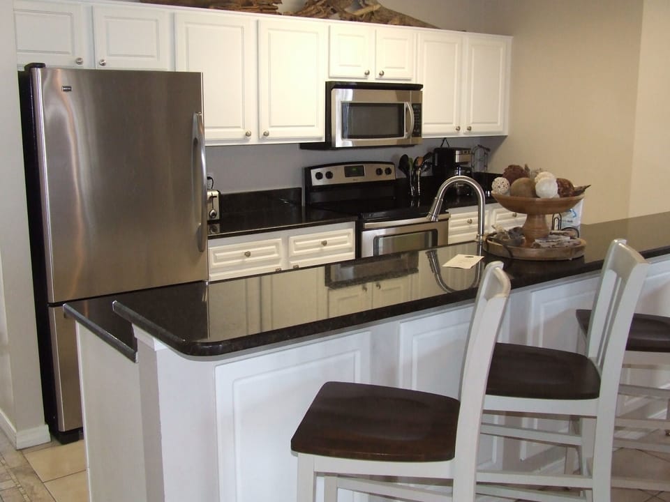 Kitchen with bar that seats 4.
