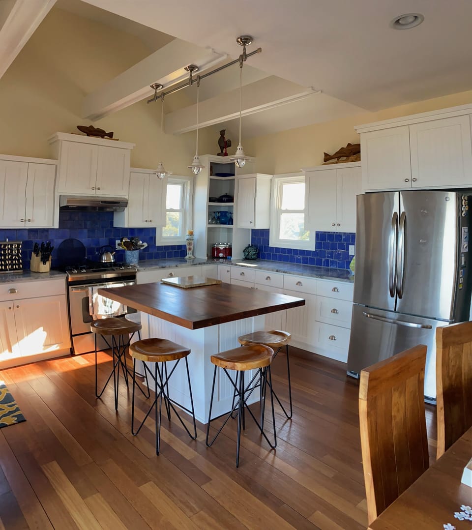 Kitchen with teak wood island.  Great for extra seating or meal service.
