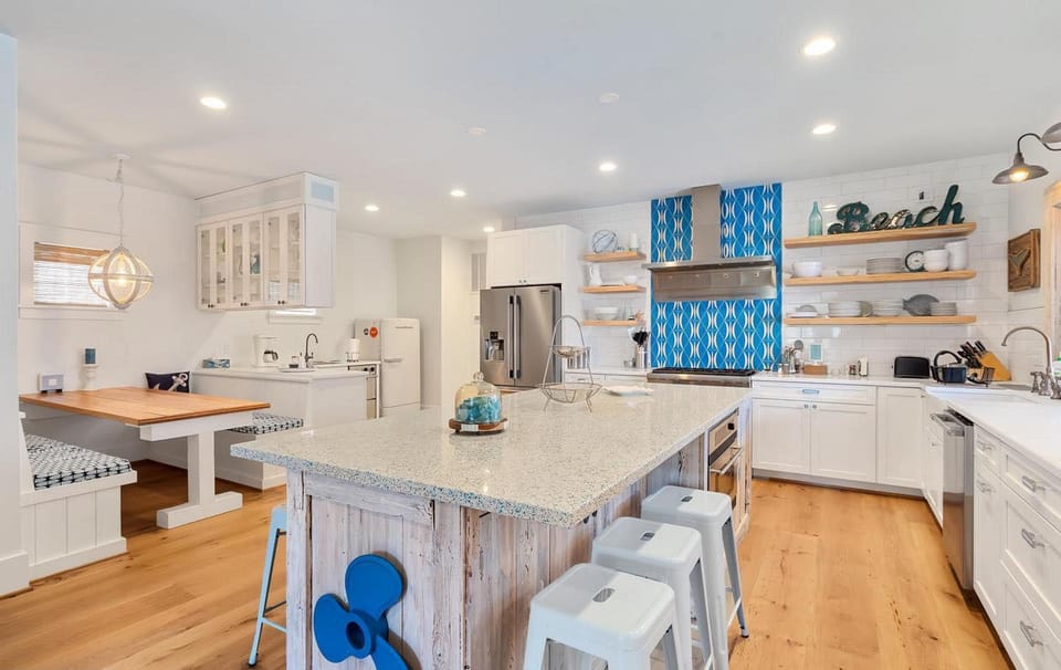 Over sized Kitchen Island easily seats 6+.  Banquet easily seats 5+.