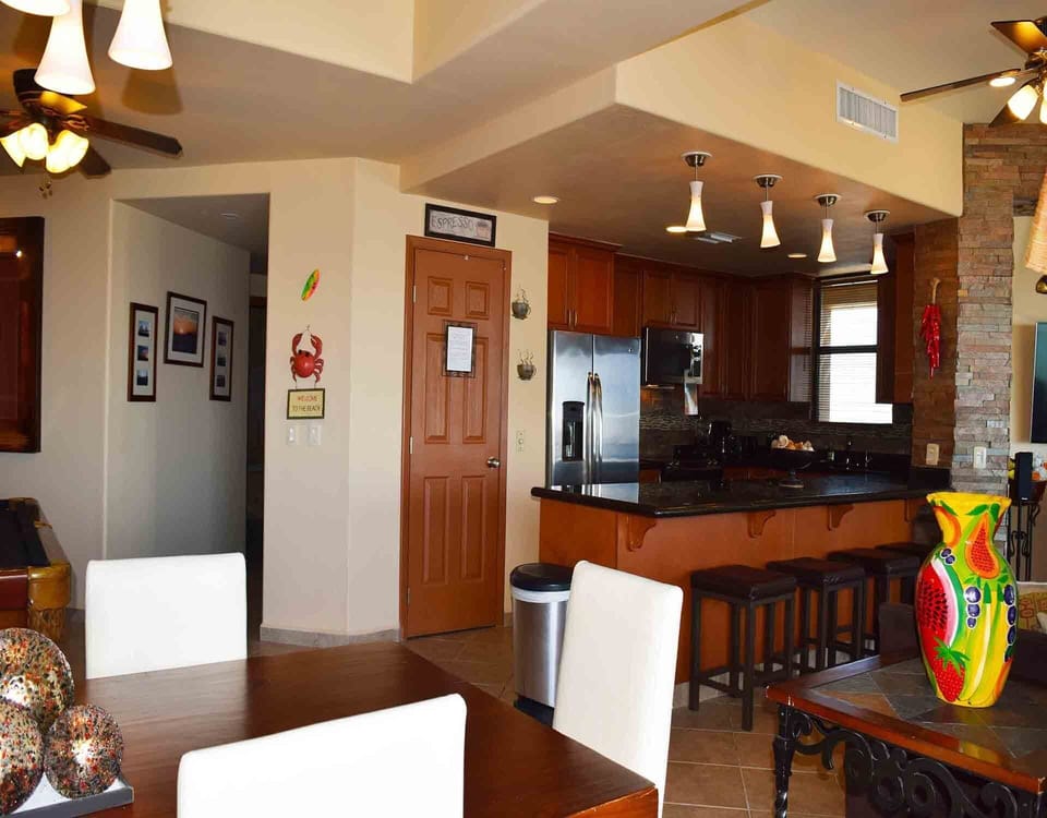 The kitchen is large and has a big counter top / breakfast sitting area