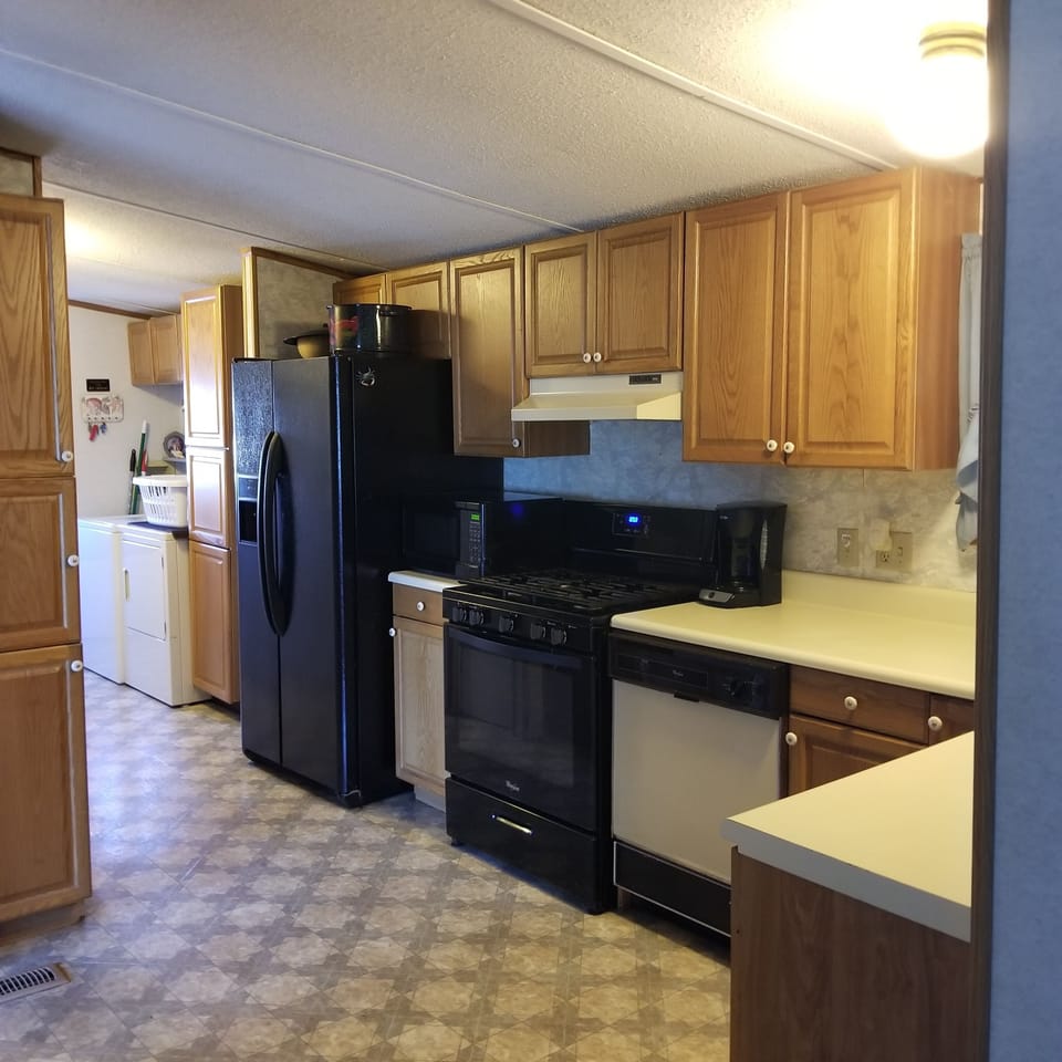 kitchen is fully equipped including new stove & refrigerator with ice-maker