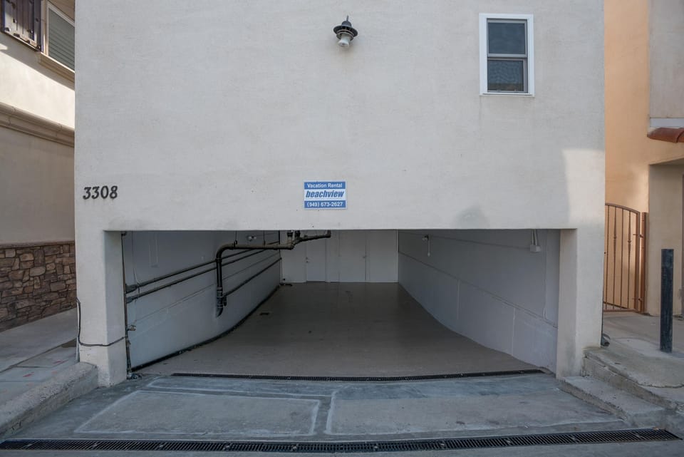 Two tandem parking spaces are designated for this unit in shared subterranean garage. Accommodates low-profile vehicles only.
                