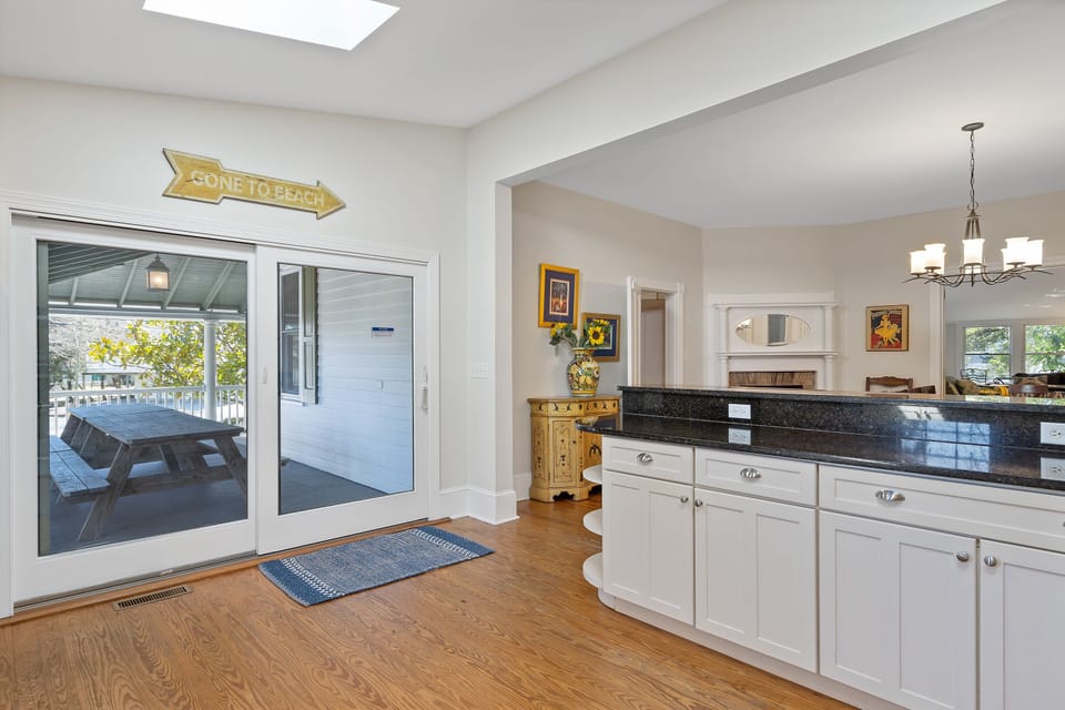 Double picnic tables located just outside the slider door