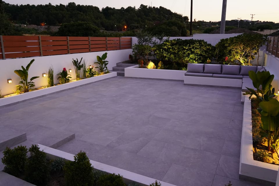 Relax at your private backyard, surrounded by flowers and atmospheric lights