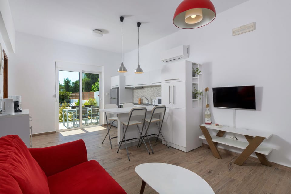 The open plan living room / kitchen provides access to your private backyard 
