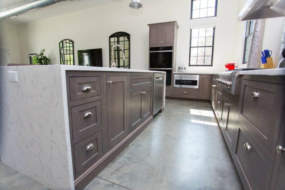 State of the art kitchen including double oven, microwave, and gas stove
