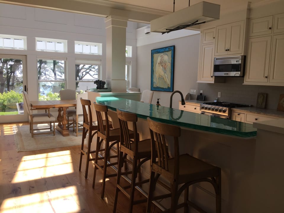 Open concept kitchen with custom glass bar designed by "Thinking Glass"  Canada