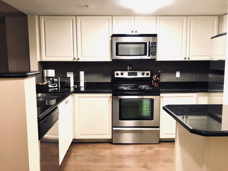Kitchen (stove, dishwasher, microwave, fridge) fully stocked w/ kitchen stuff