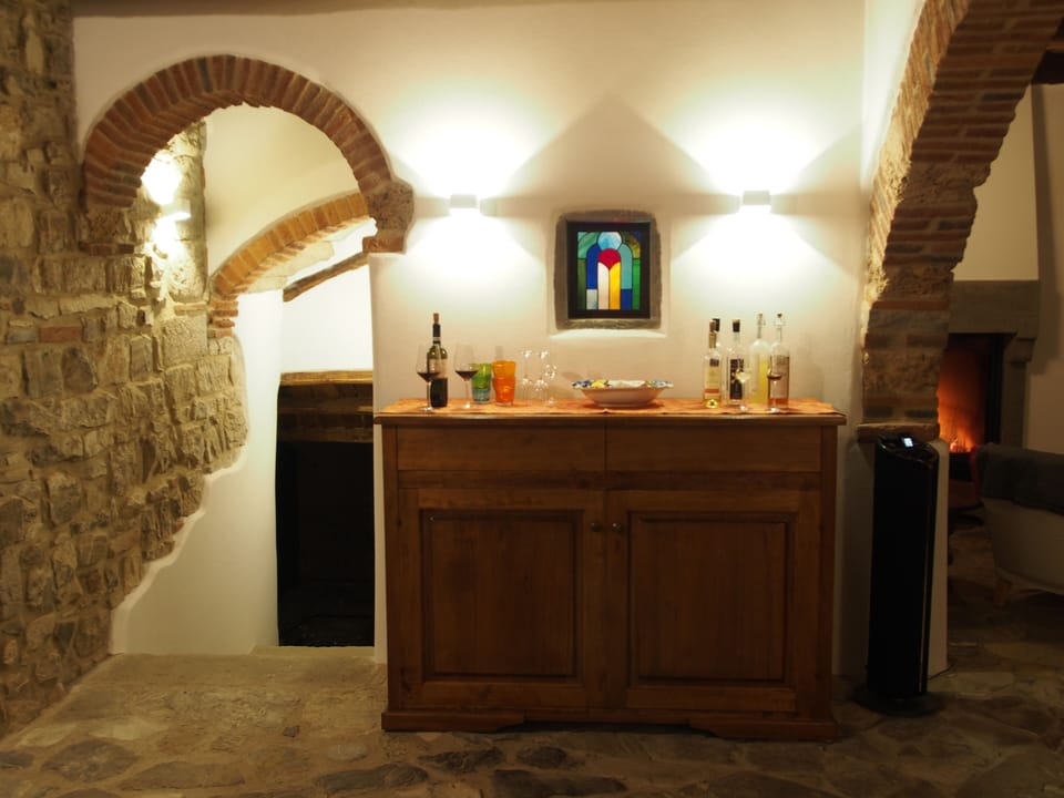 Savor a nightcap where history whispers at the stairs to the wine cellar