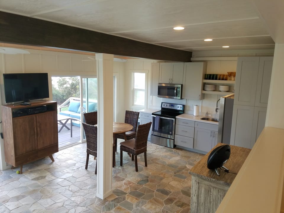 view of kitchen and dining from bedroom