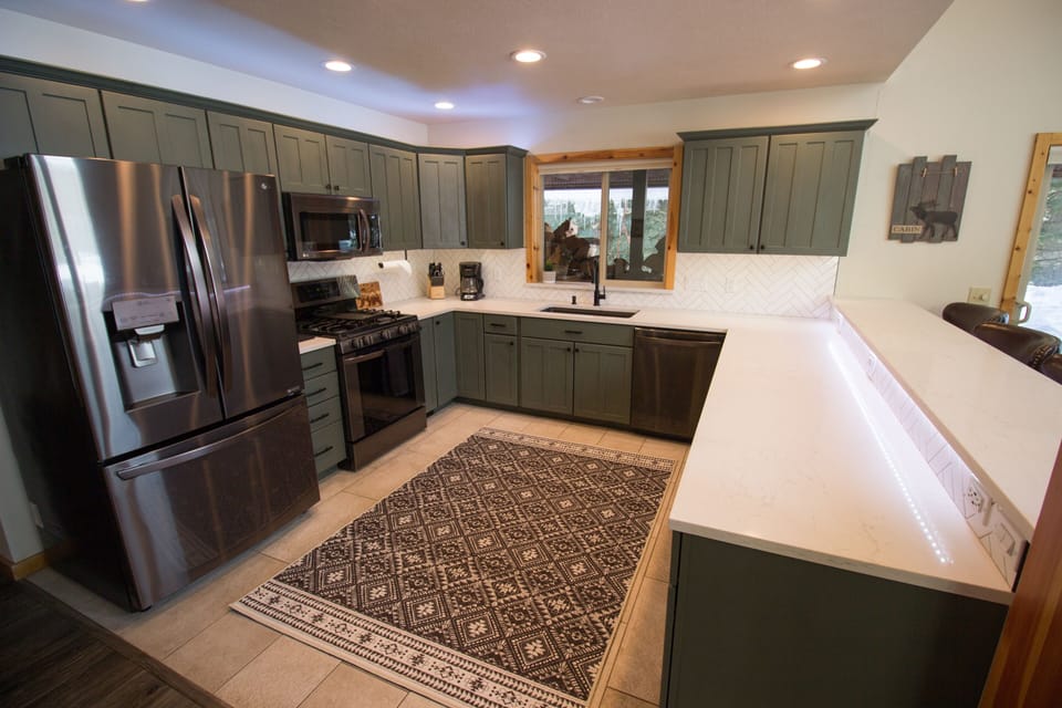 Brand new remodeled kitchen!  Custom floor and backsplash tile, quartz counters.