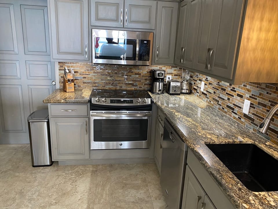 All appliances are new, faucets fixtures new. Exotic style granite tops.