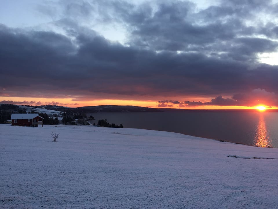 Sunrise early winter.  The new house is across the property on left