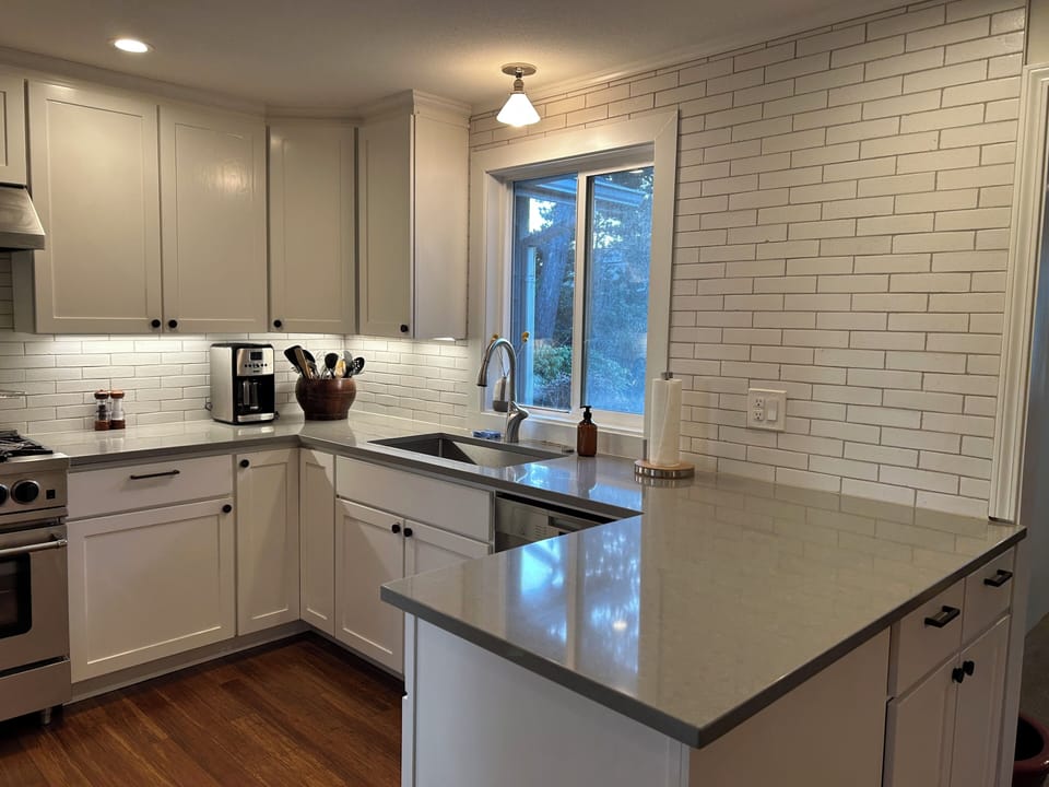 Fully stocked kitchen with coffee maker, microwave, toaster oven and more.
