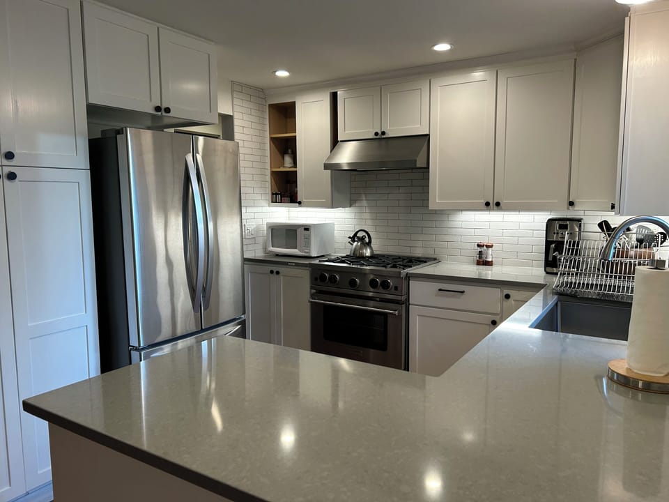 New appliances, including gas stove, icemaker. Plenty of utensils, pots, pans.